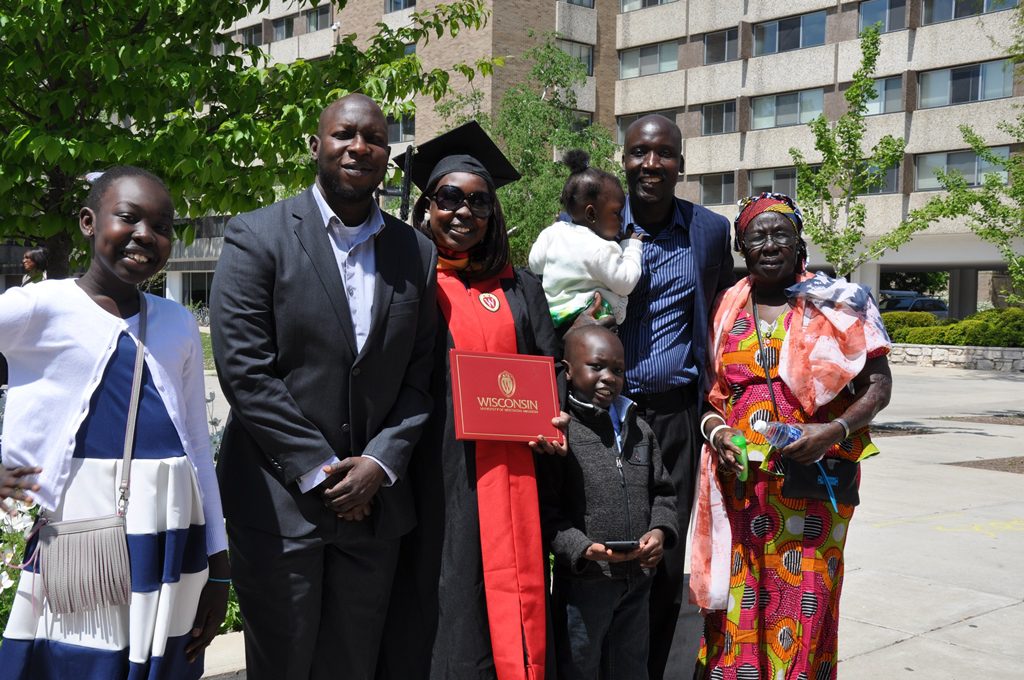 Odyssey Project and master's degree graduate Josephine Lorya-Ozulamoi and her family