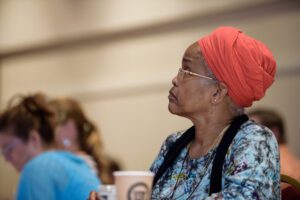 woman attentively listening to speaker at 2017 Rethinking Leadership Conference