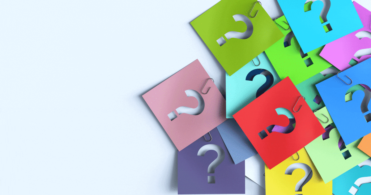 sticky notes with question marks and paper clips