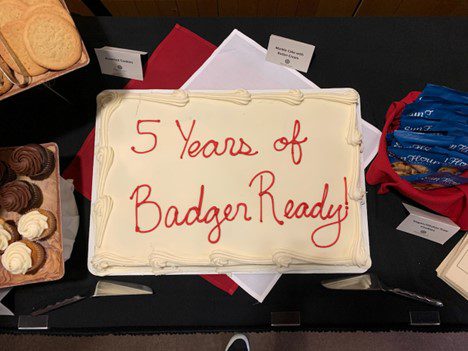 Large cake that says 5 years of Badger Ready
