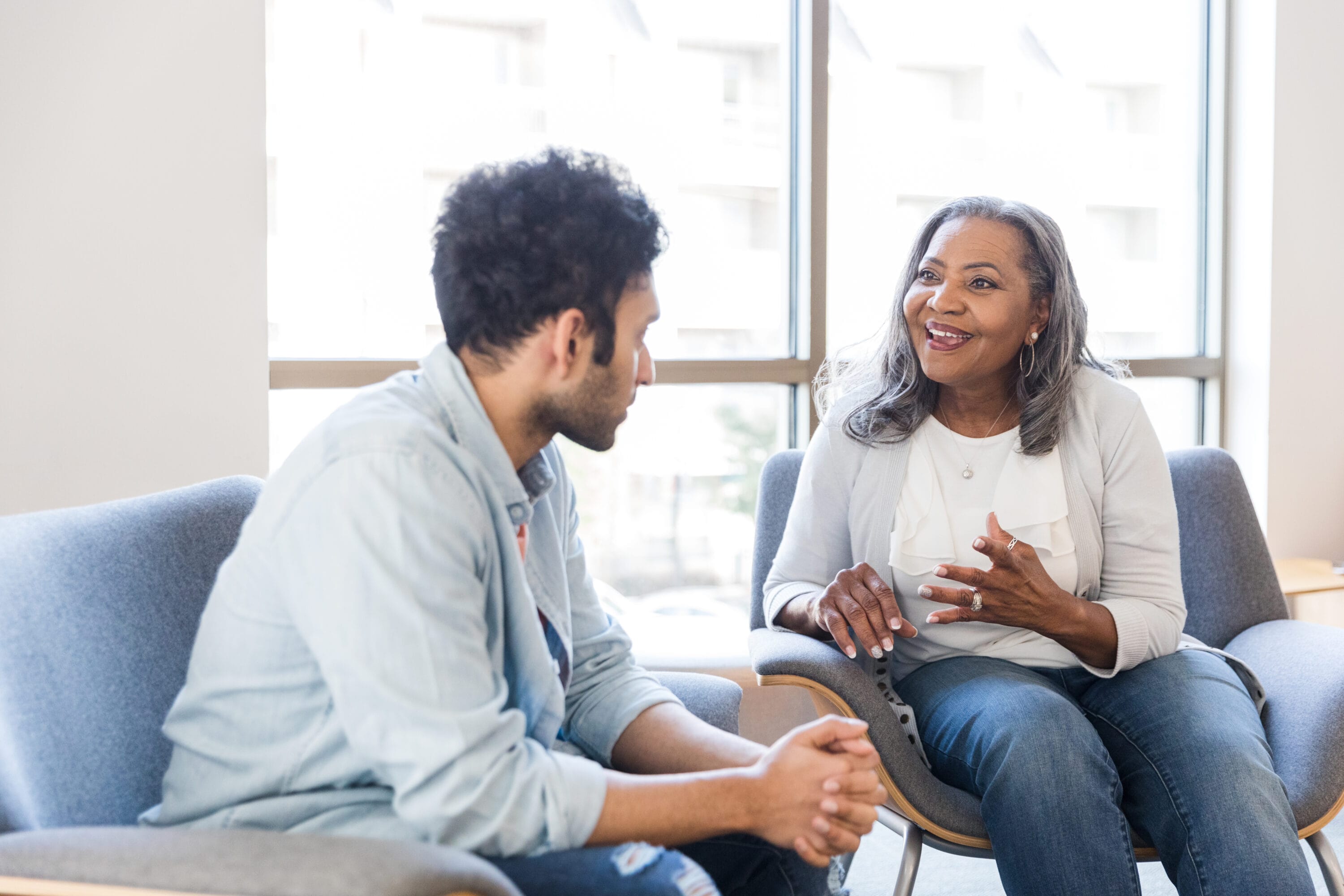 A woman and a man speaking to each other